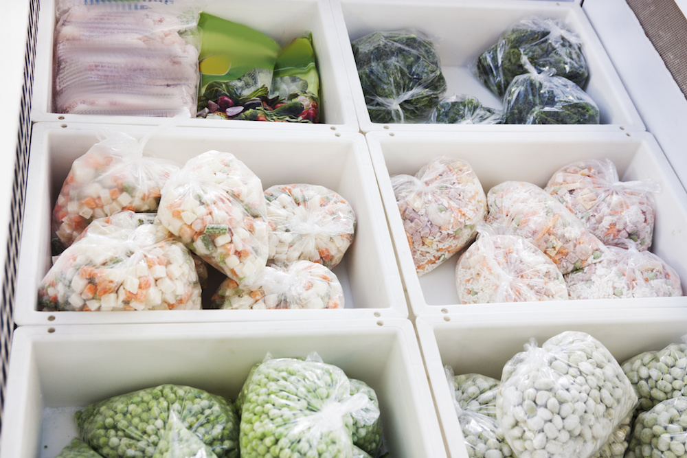 colorful frozen vegetables in a supermarket in the refrigerator
